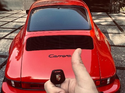 Viktor Rajek showing his Porsche 911 carrera.